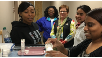 A group of women doing training to be a certified nursing assistant